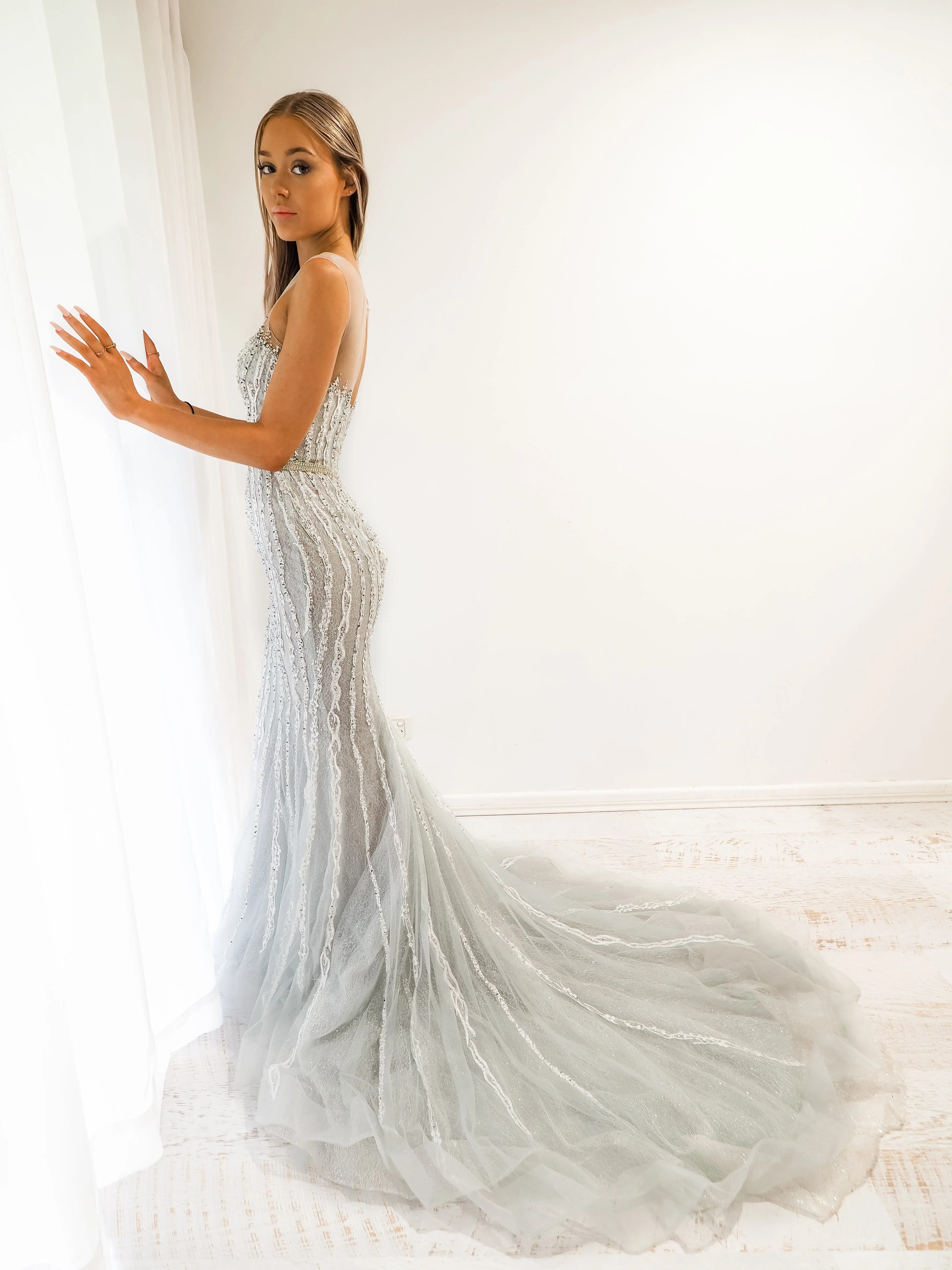 Silver mermaid dress with long train for hire